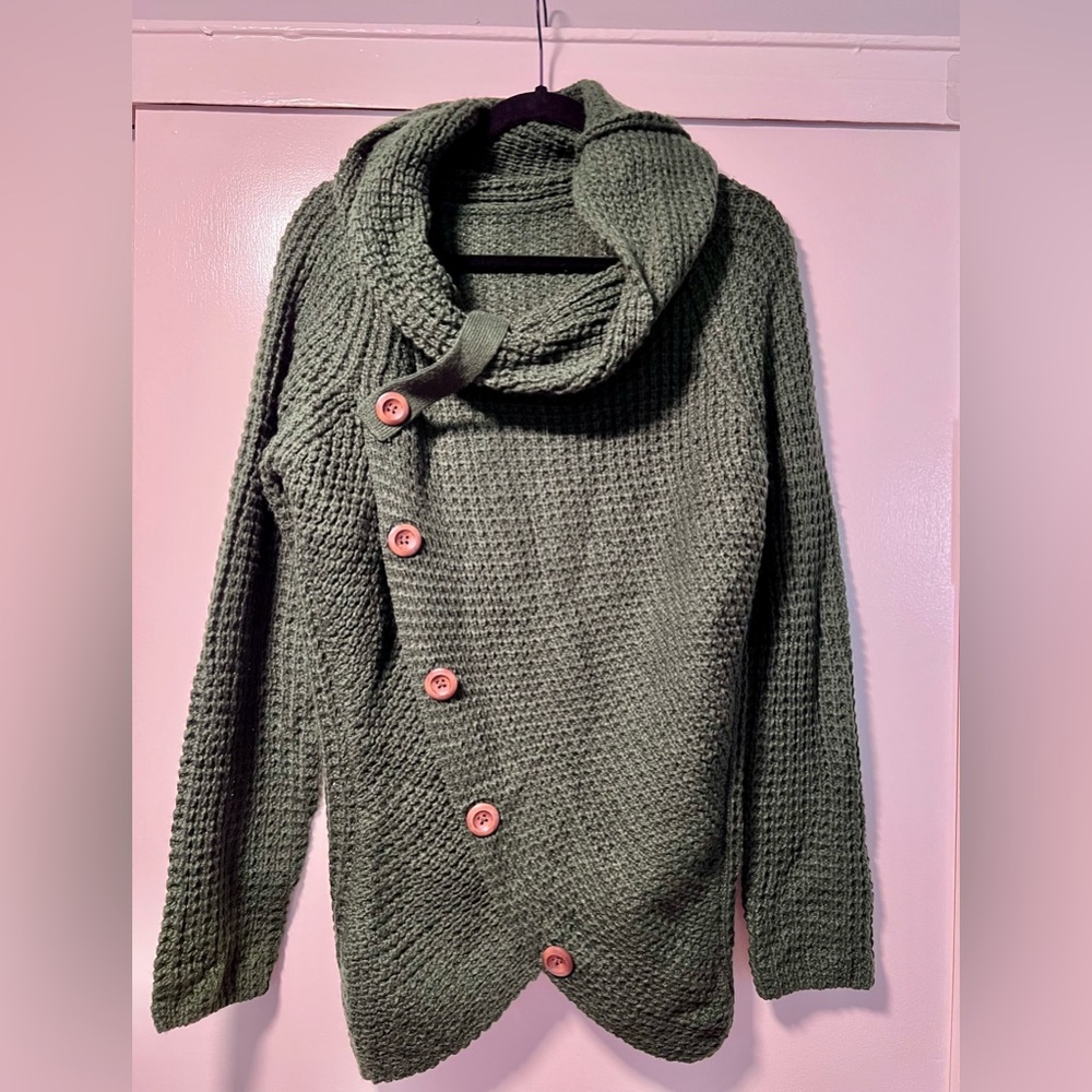 Green knit cross sweater